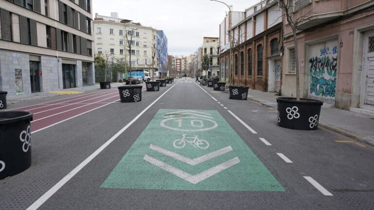 One of Barcelona's superblock streets, with trees, a wide cycle lane, sport tracks -- instead of car traffic