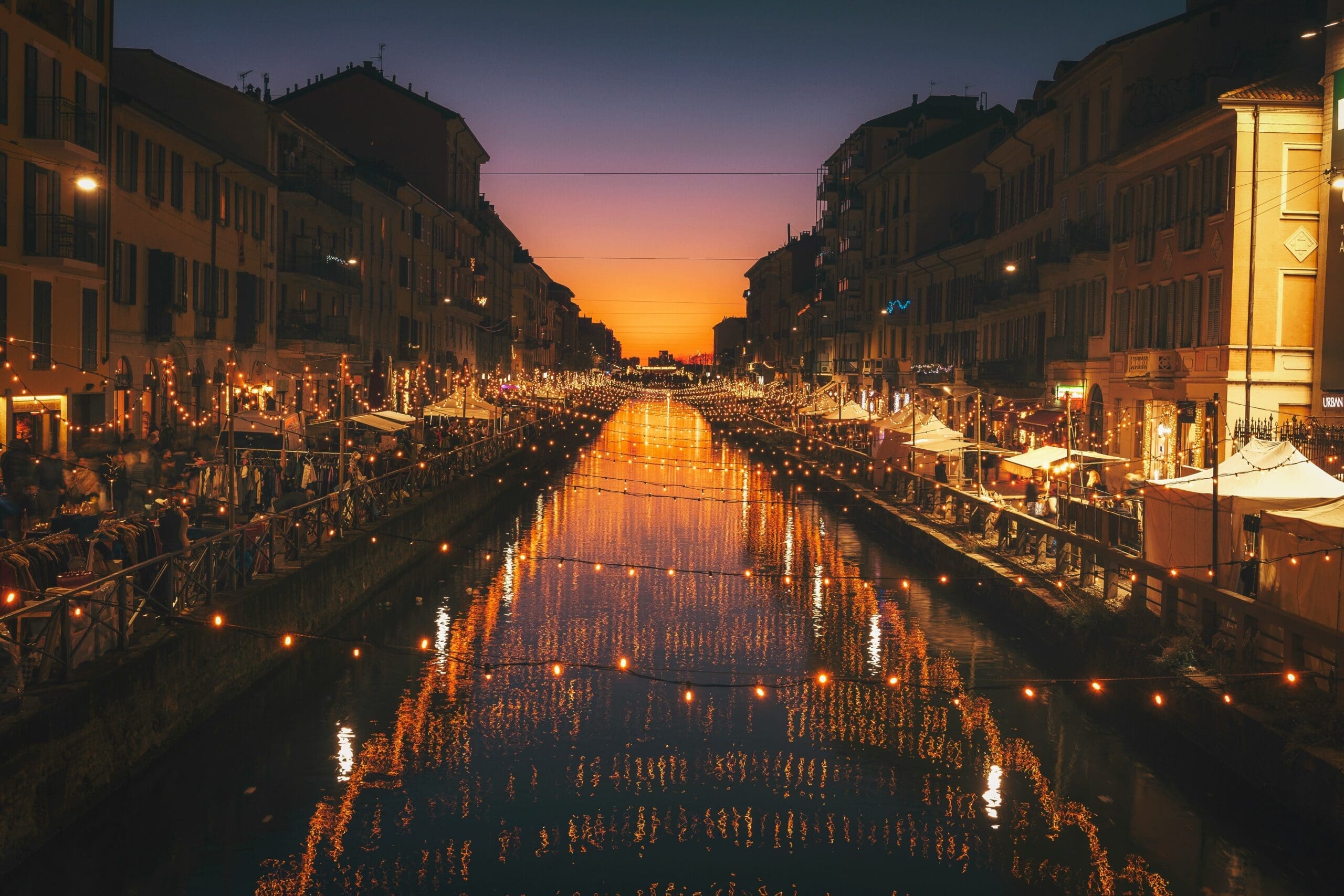 Popular Milanese canal area, light chains illuminate the night; many bars and restaurants to visit