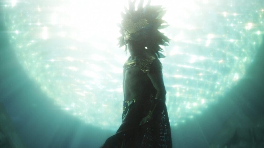 A silhouetted figure wearing an ornate headdress and jewelry stands against a glowing, turquoise, light-filled background, evoking an underwater or ethereal atmosphere.