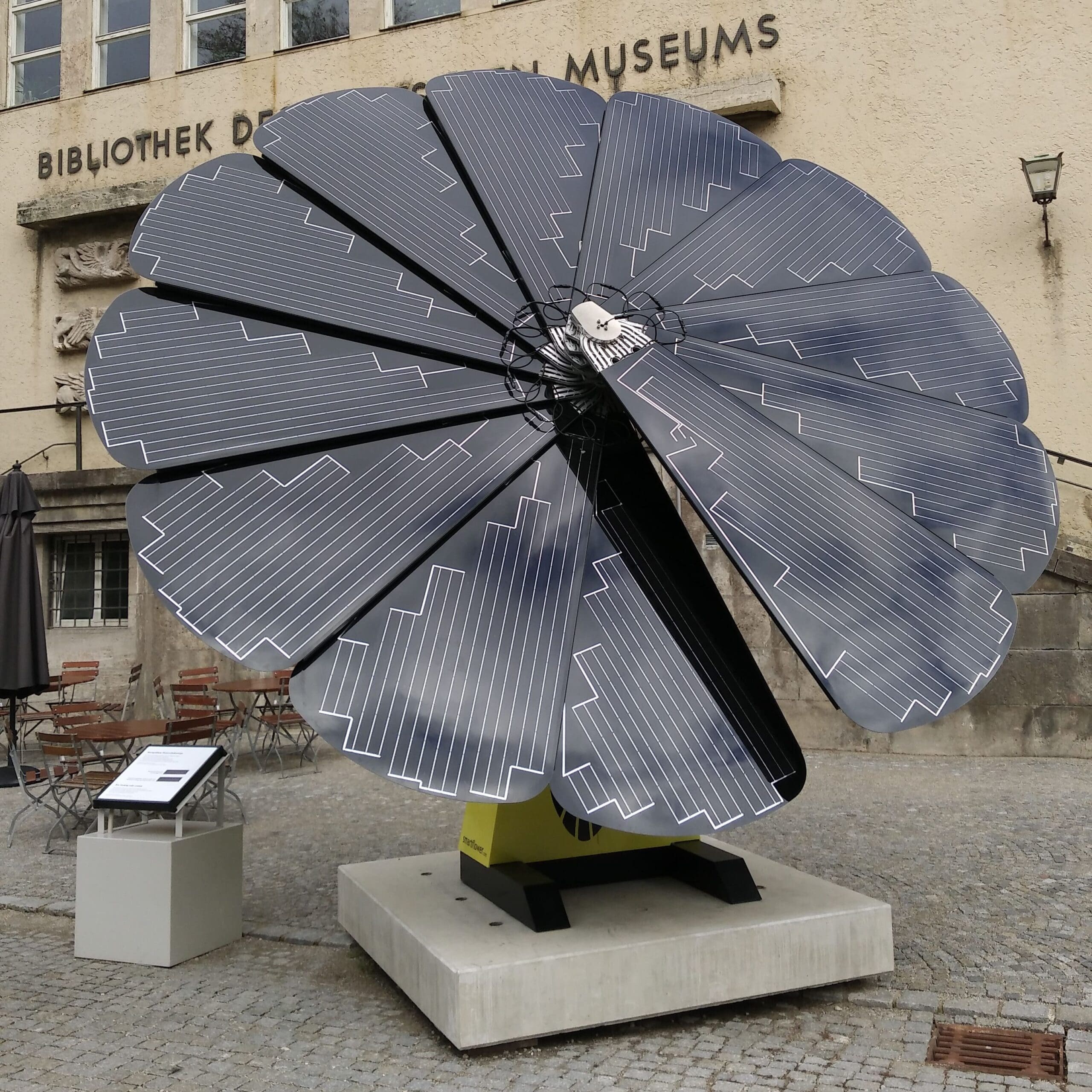 Foldable "Solar Flower" with photovoltaic petals, in front of the Deutsche Museum, Munich, Germany