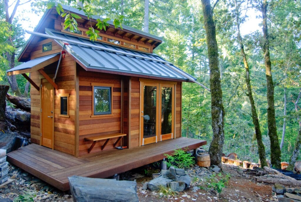 Wooden tiny house located in a forest