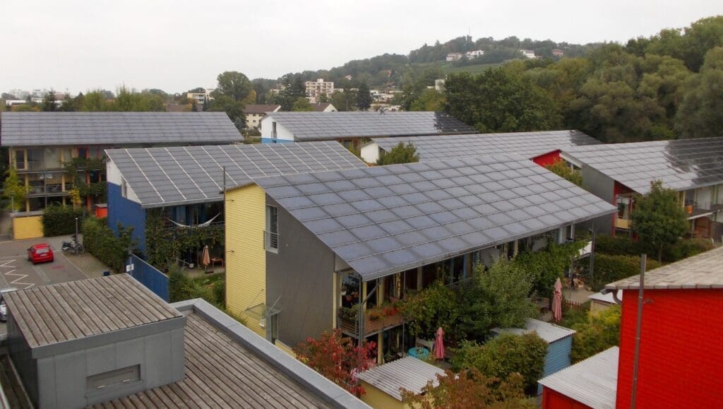 Vauban District in Freiburg, Germany, with rows of low-energy buildings having their windows and fully solar panel clad roofs oriented towards the sun