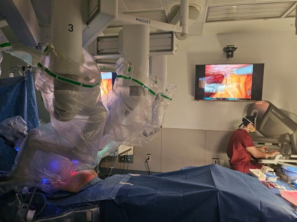 The Columbia Hernia Center using robotic arms to execute surgery, supported by the Da Vinci System