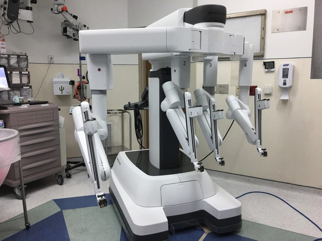 Da Vinci Xi surgery system, showing the four-armed precision robot in a hospital room
