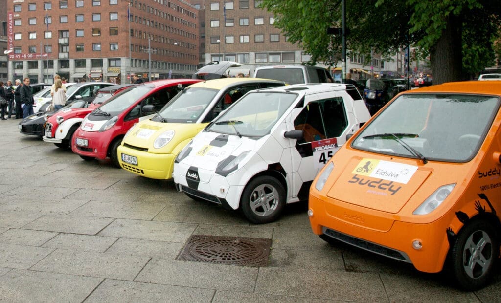 Several colorful "bubble" EVs parking in Oslo; they were part of a Zero Emissions Rally in 2011
