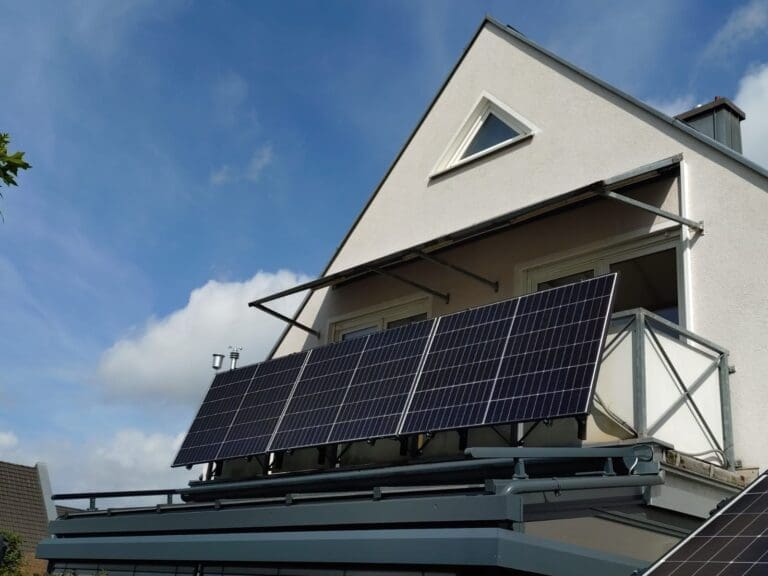 Standard balcony power plant setup with PV modules hanging over the railing