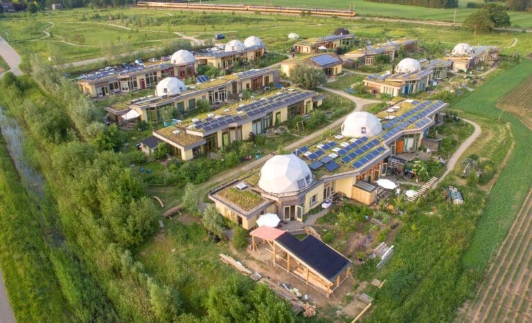 Aardehuizen eco-village aerial view; some of the houses are topped with half-dome roofs